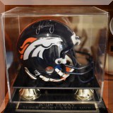 C07. Denver Broncos mini helmet signed by John Elway. 